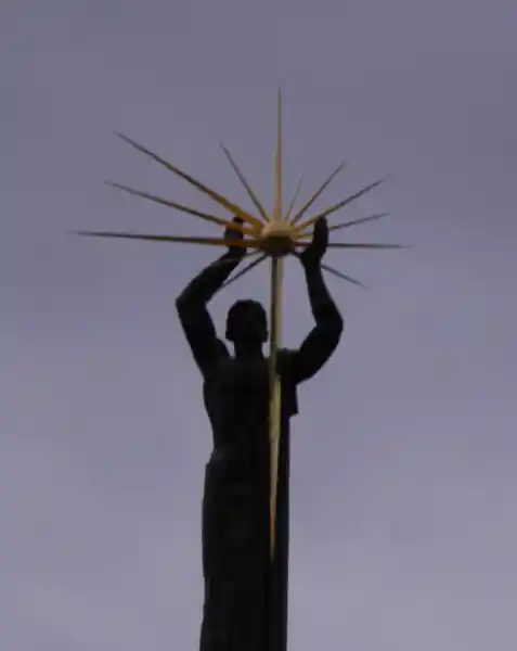 The bronze man and the sun monument